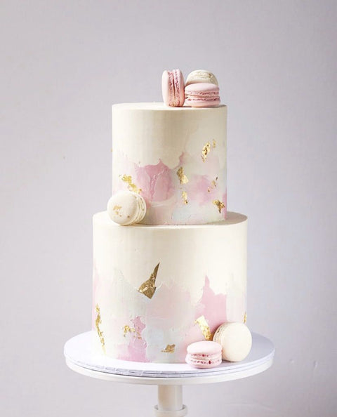 Cakes by Gina Bakery Houston, TX pink and gold two tier wedding cake with macarons