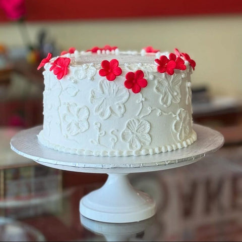 Tiara Cakes Bakery Houston, TX white cake with red fondant flowers